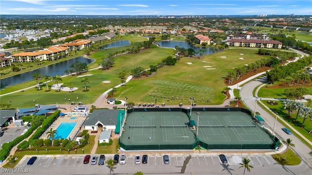 birds eye view of property featuring a water view and golf course view