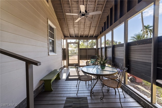 unfurnished sunroom featuring wood ceiling, ceiling fan, and lofted ceiling