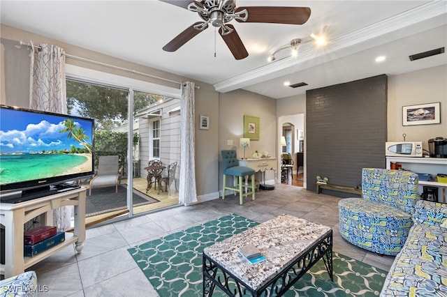 tiled living room featuring ceiling fan