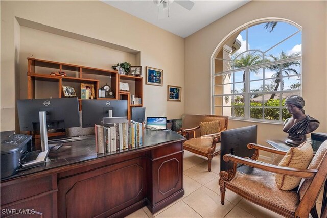 tiled office featuring ceiling fan