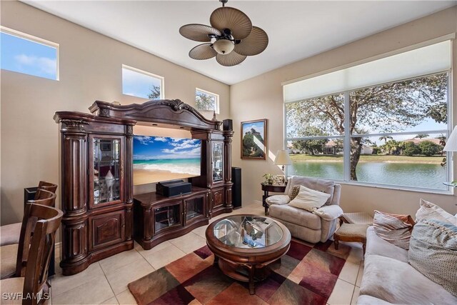 tiled living room featuring ceiling fan