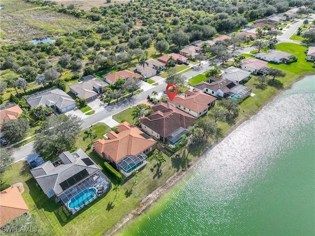 aerial view featuring a residential view and a water view