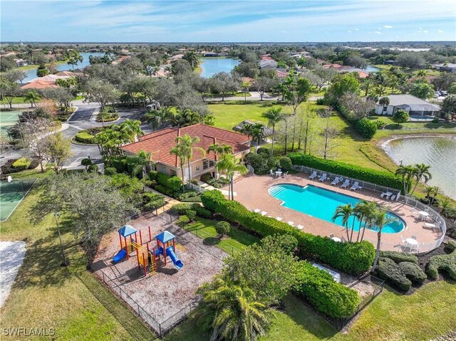 birds eye view of property with a water view