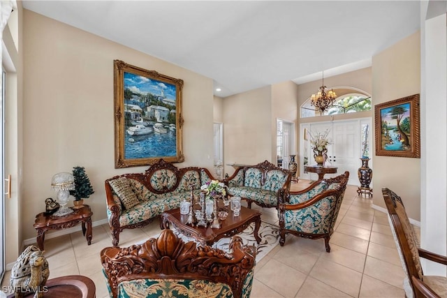 living area with baseboards, a notable chandelier, and light tile patterned flooring