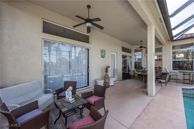 view of patio / terrace featuring ceiling fan, an outdoor living space, a lanai, and a swimming pool