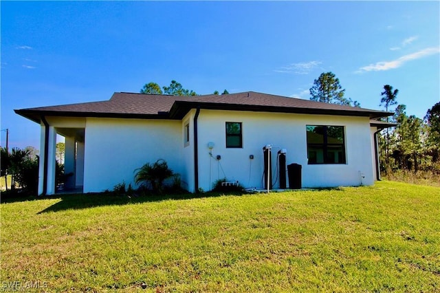 back of house with a yard