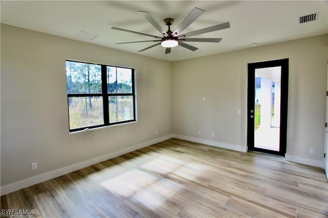 unfurnished room with ceiling fan and light hardwood / wood-style floors