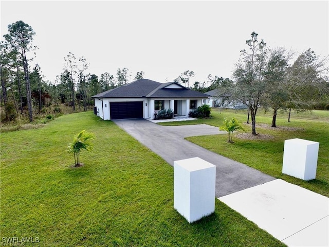 single story home featuring a garage and a front yard