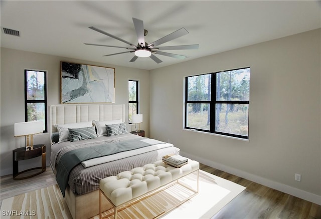 bedroom featuring ceiling fan and light hardwood / wood-style floors