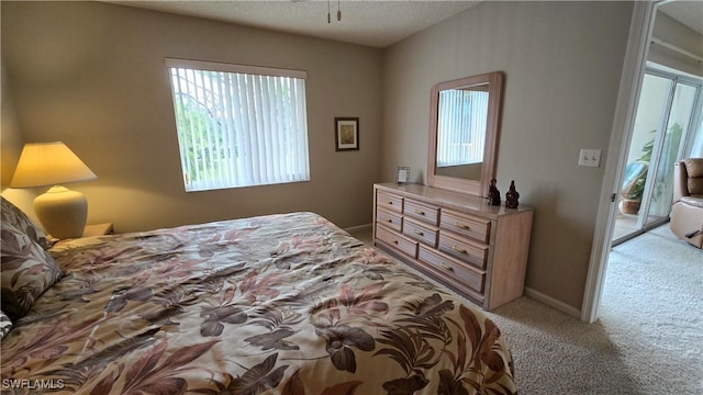 bedroom featuring light colored carpet