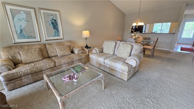 living room featuring carpet, vaulted ceiling, and a notable chandelier