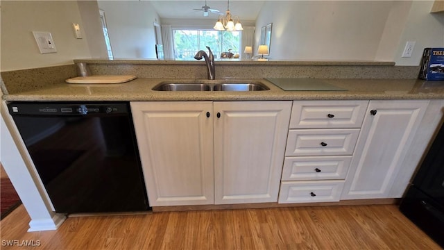 kitchen featuring black dishwasher, white cabinetry, a chandelier, sink, and light hardwood / wood-style flooring