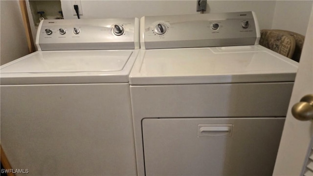 washroom featuring washer and dryer