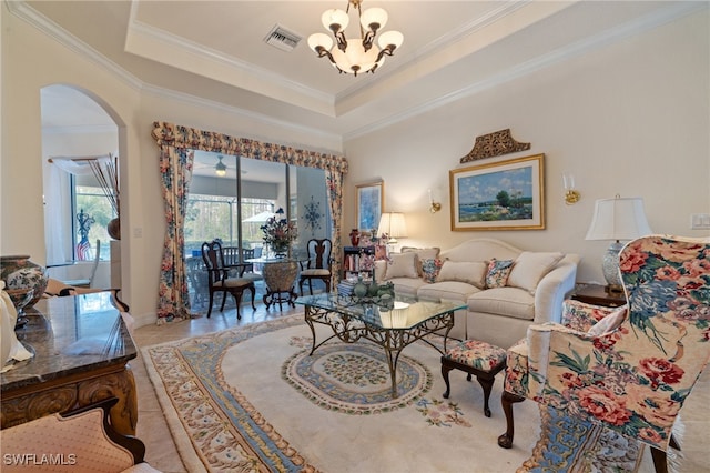 living room featuring crown molding, light tile patterned floors, a raised ceiling, and a notable chandelier