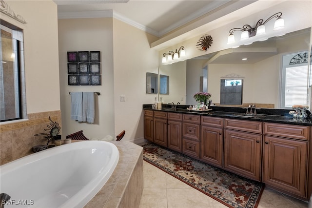 bathroom with a bath, crown molding, tile patterned flooring, and a sink