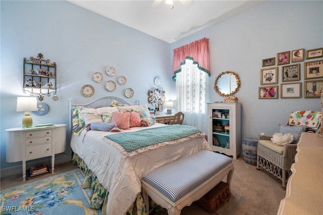 bedroom featuring ceiling fan, lofted ceiling, and carpet floors