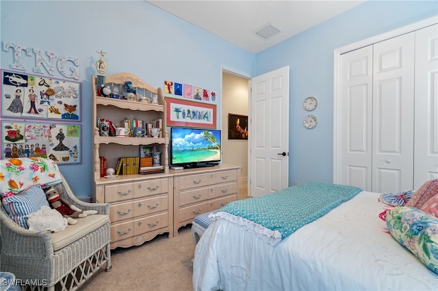 carpeted bedroom featuring a closet