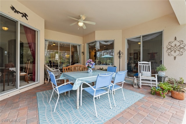 exterior space with a ceiling fan and outdoor dining space