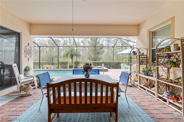 view of patio / terrace with a lanai and an outdoor pool