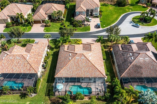 birds eye view of property with a residential view