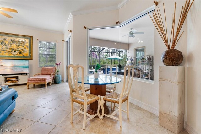 dining area featuring a ceiling fan, ornamental molding, and a wealth of natural light