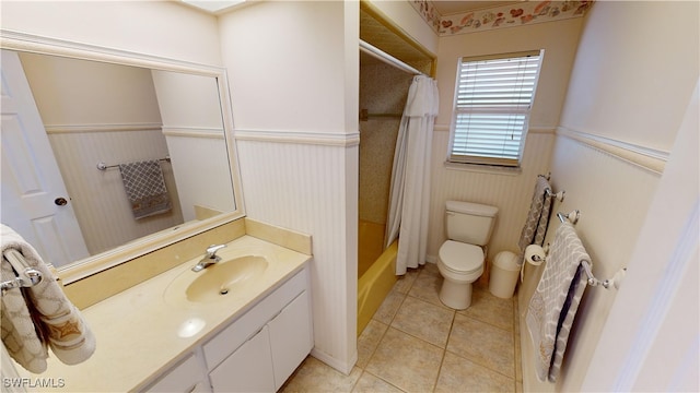 full bathroom featuring toilet, tile patterned flooring, shower / bath combination with curtain, and vanity