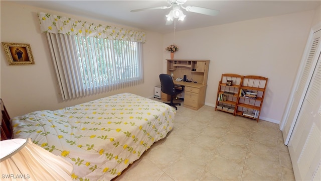 bedroom featuring ceiling fan and a closet