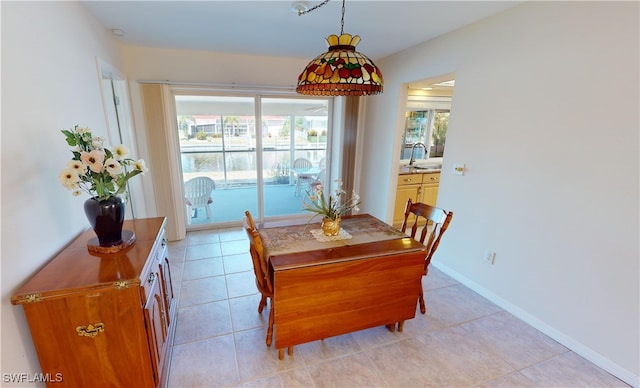 tiled dining area with sink