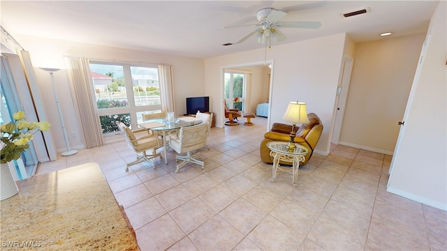 interior space featuring ceiling fan and light tile patterned floors