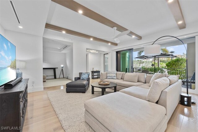 living room featuring beam ceiling, recessed lighting, light wood-style flooring, and ceiling fan