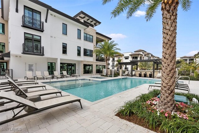 view of pool featuring a pergola and a patio area