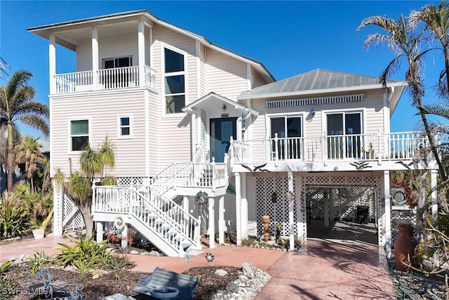 back of property featuring a carport