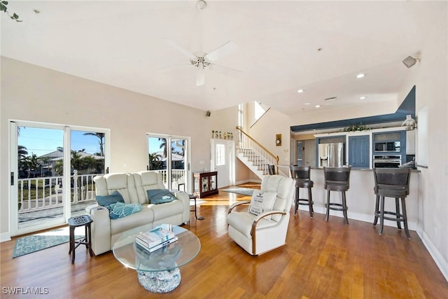 living room with ceiling fan and hardwood / wood-style floors