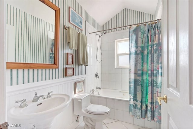 full bathroom with toilet, tile patterned flooring, vaulted ceiling, sink, and shower / bath combination with curtain