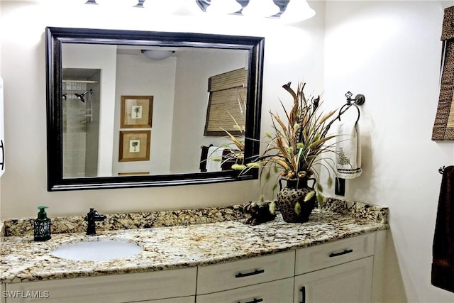 bathroom featuring vanity and a shower