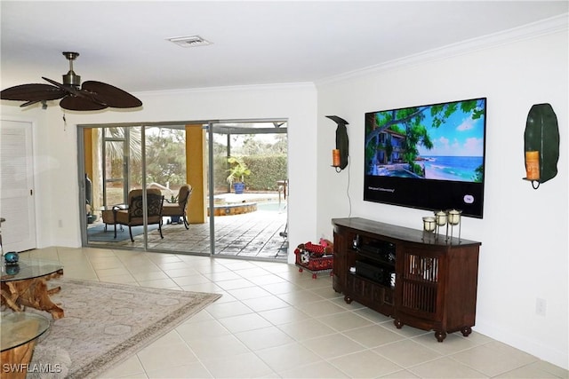 living room featuring light tile patterned floors, crown molding, and ceiling fan