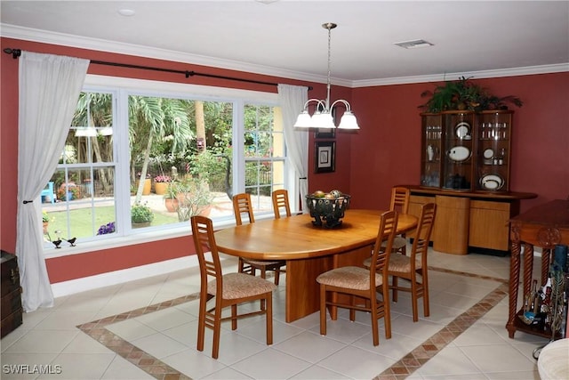 tiled dining area with crown molding and a notable chandelier