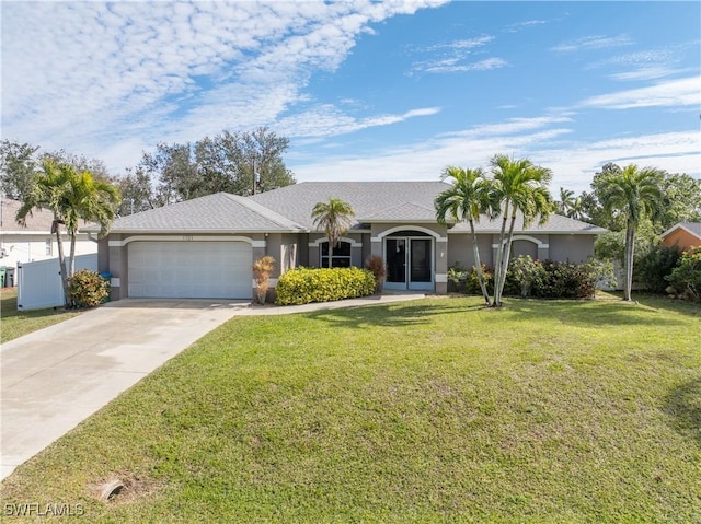 ranch-style house with a garage and a front lawn