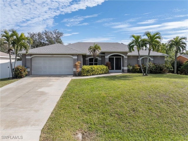 ranch-style house with a garage and a front lawn