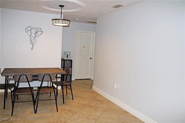 dining area with light tile patterned floors