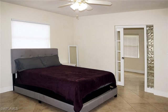 tiled bedroom with ceiling fan