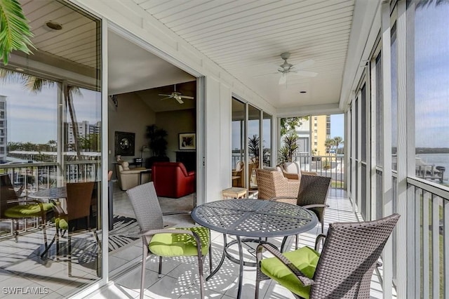 sunroom / solarium with ceiling fan