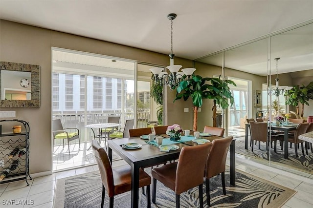 tiled dining space featuring a chandelier