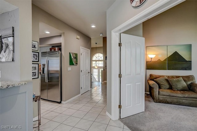 hall with light tile patterned flooring