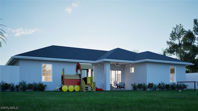 rear view of house with a patio area and a yard