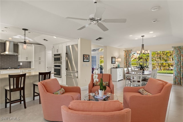 living area with recessed lighting, a healthy amount of sunlight, and visible vents