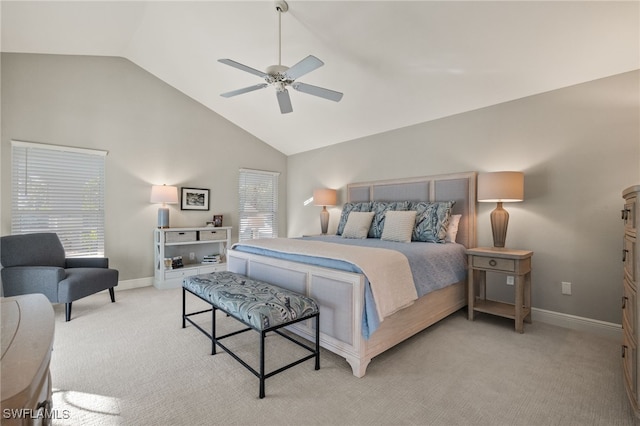 bedroom with light carpet, high vaulted ceiling, a ceiling fan, and baseboards