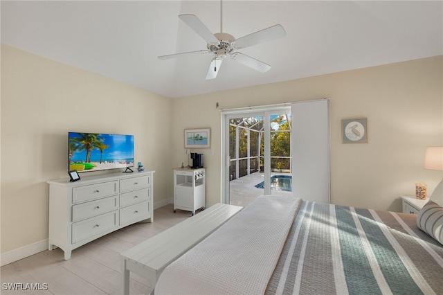 bedroom with baseboards, a ceiling fan, lofted ceiling, access to exterior, and light wood-style floors