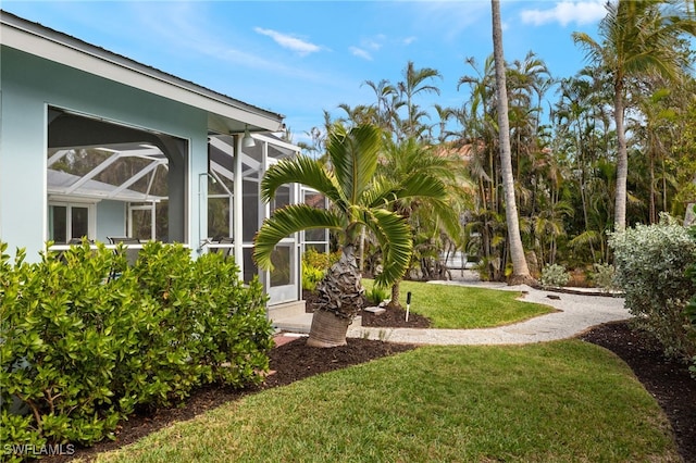 view of yard featuring a lanai