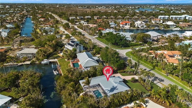 aerial view with a residential view and a water view